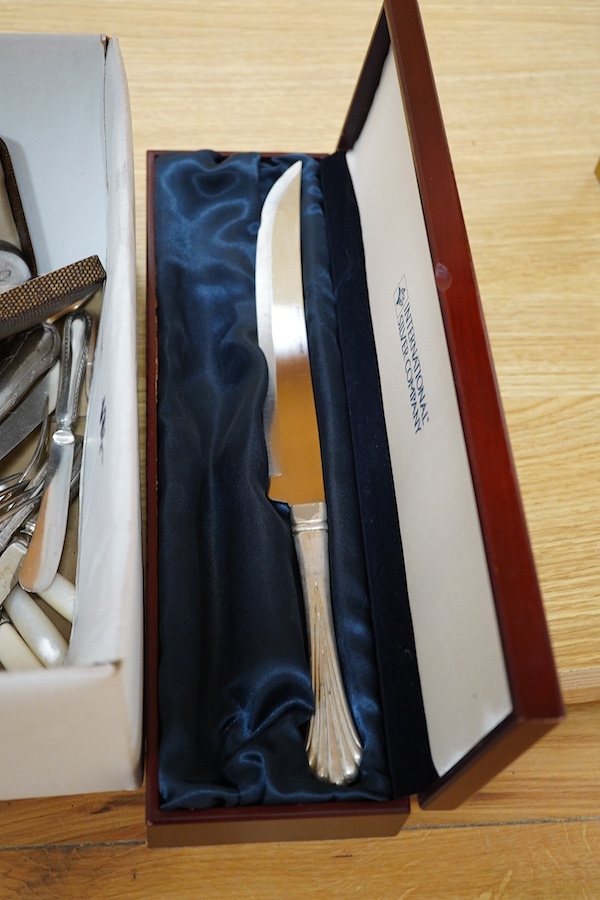 A quantity of silver plate to include cutlery, dishes, a wine coaster, etc. Condition - varies, poor to fair